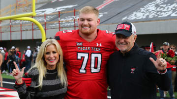 Nov 18, 2023; Lubbock, Texas, USA;  Texas Tech Red Raiders senior offensive lineman Cole Spencer (70) with head coach Joey McGuire and wife Debbie before the game against the Central Florida Knights at Jones AT&T Stadium and Cody Campbell Field. Mandatory Credit: Michael C. Johnson-USA TODAY Sports