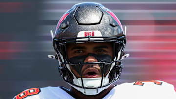 Tampa Bay Buccaneers offensive tackle Tristan Wirfs warms up   before a game against the Denver Broncos.