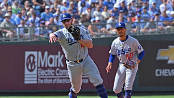 Jun 28, 2025; Kansas City, Missouri, USA;  Los Angeles Dodgers third baseman Max Muncy (13) throws to first base for an out in the fifth inning against the Kansas City Royals at Kauffman Stadium. Mandatory Credit: Peter Aiken-Imagn Images