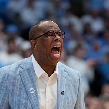 Dec 4, 2024; Chapel Hill, North Carolina, USA;  North Carolina Tar Heels head coach Hubert Davis reacts in the second half at Dean E. Smith Center. Mandatory Credit: Bob Donnan-Imagn Images