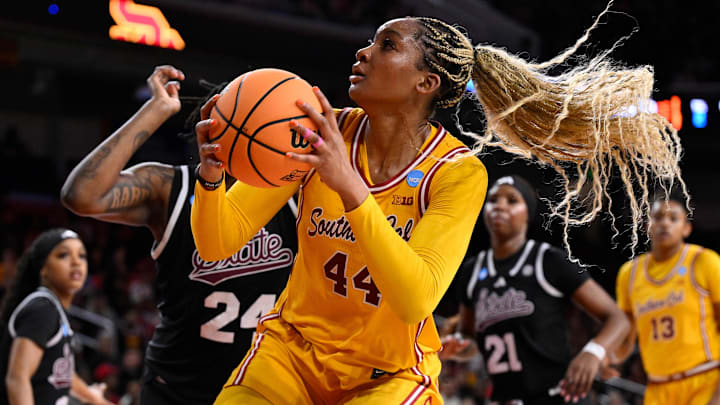 Mar 24, 2025; Los Angeles, California, USA; USC Trojans forward Kiki Iriafen (44) drives to the basket past Mississippi State Bulldogs forward Quanirah Montague (24) during an NCAA Tournament second round game at Galen Center. Mandatory Credit: Robert Hanashiro-Imagn Images