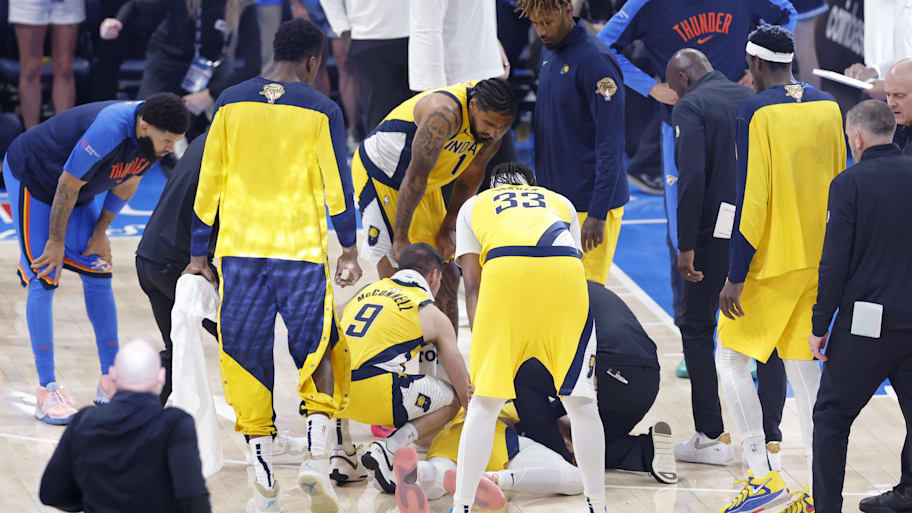 Indiana Pacers guard Haliburton is checked on after an apparent injury following a play against the Oklahoma City Thunder during the first half of game seven of the 2025 NBA Finals at Paycom Center.  | Alonzo Adams-Imagn Images