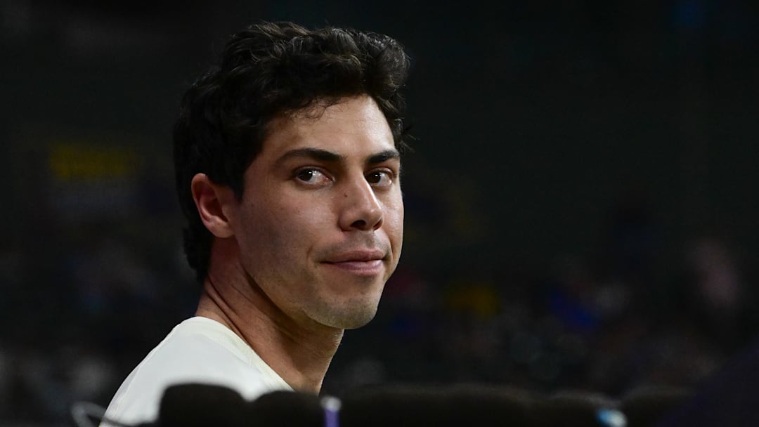 Sep 17, 2025; Milwaukee, Wisconsin, USA;  Milwaukee Brewers designated hitter Christian Yelich (22) looks on from the dugout in the fourth inning against the Los Angeles Angels at American Family Field. Mandatory Credit: Benny Sieu-Imagn Images
