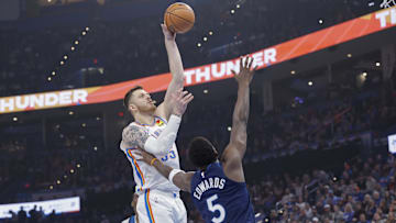 Feb 24, 2025; Oklahoma City, Oklahoma, USA; Oklahoma City Thunder center Isaiah Hartenstein (55) shoots over Minnesota Timberwolves guard Anthony Edwards (5) during the first quarter at Paycom Center. Mandatory Credit: Alonzo Adams-Imagn Images