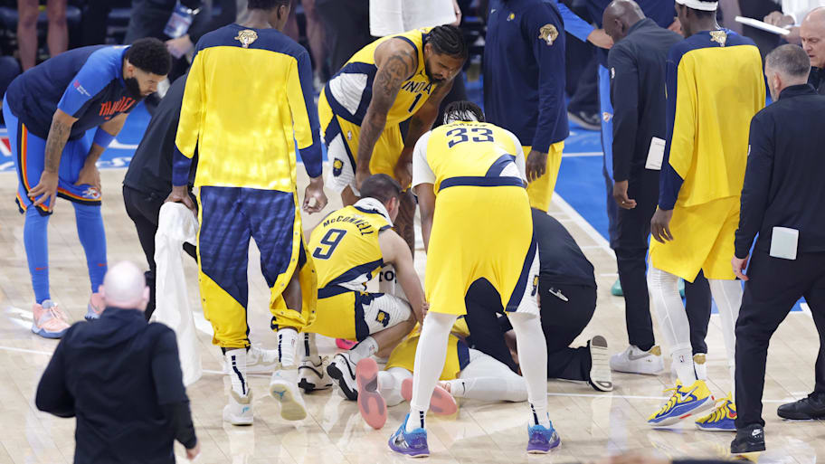 Teammates surround Tyrese Haliburton following an injury during the first quarter of Game 7.  | Alonzo Adams-Imagn Images