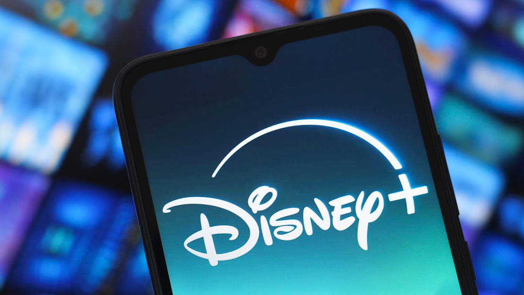 In this photo illustration, the Disney Plus logo is seen...