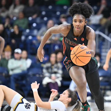 Jan 14, 2024; South Bend, Indiana, USA; Miami Hurricanes guard Jaida Patrick (5) steals the ball from Notre Dame Fighting Irish guard Sonia Citron (11) in the second half at the Purcell Pavilion. Mandatory Credit: Matt Cashore-Imagn Images