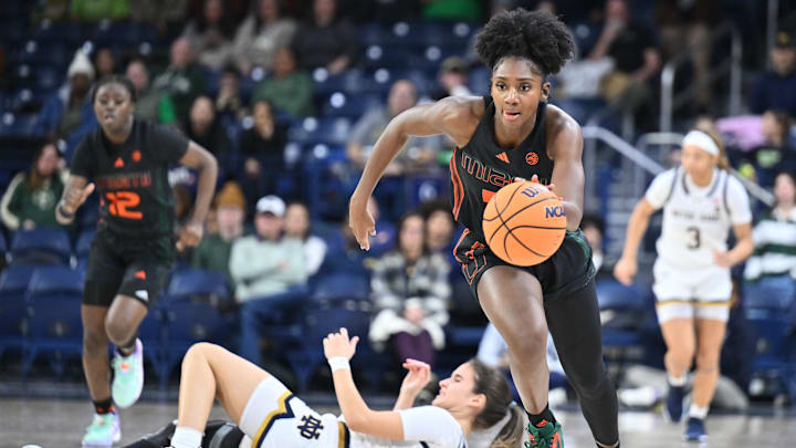 Jan 14, 2024; South Bend, Indiana, USA; Miami Hurricanes guard Jaida Patrick (5) steals the ball from Notre Dame Fighting Irish guard Sonia Citron (11) in the second half at the Purcell Pavilion. Mandatory Credit: Matt Cashore-Imagn Images