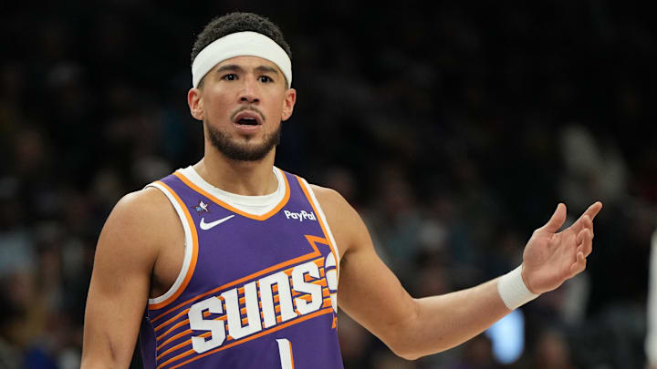 Phoenix Suns guard Devin Booker (1) reacts after a foul call against the Philadelphia 76ers during the second half of an NBA game at Mortgage Matchup Center.