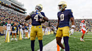 Notre Dame running back Jeremiyah Love (4) makes a heart sign after scoring a touchdown in the first half of a NCAA football game against Syracuse at Notre Dame Stadium on Saturday, Nov. 22, 2025, in South Bend.