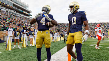 Notre Dame running back Jeremiyah Love (4) makes a heart sign after scoring a touchdown in the first half of a NCAA football game against Syracuse at Notre Dame Stadium.
