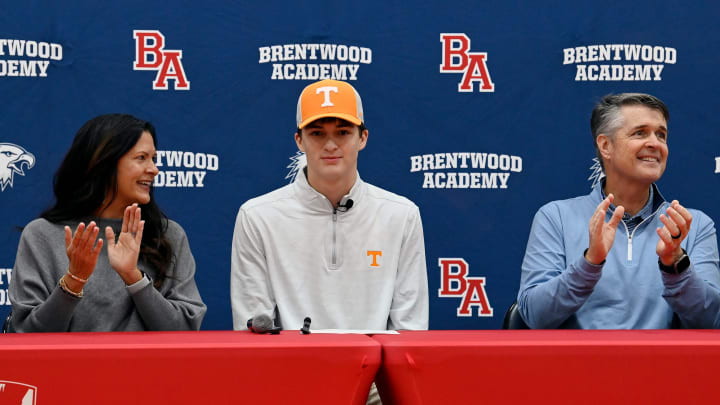 Brentwood Academy quarterback George MacIntyre announces his commitment to the University of Tennessee with his parents Sarah and Matt McIntyre during a ceremony at Brentwood Academy on Monday, Jan. 22, 2024 in Brentwood, Tenn. MacIntyre is the number 3-ranked quarterback for the class 2025.