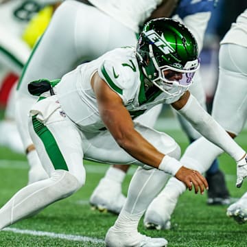 Nov 13, 2025; Foxborough, Massachusetts, USA; New York Jets quarterback Justin Fields (7) looses the ball on the snap against the New England Patriots in the fourth quarter at Gillette Stadium. Mandatory Credit: David Butler II-Imagn Images