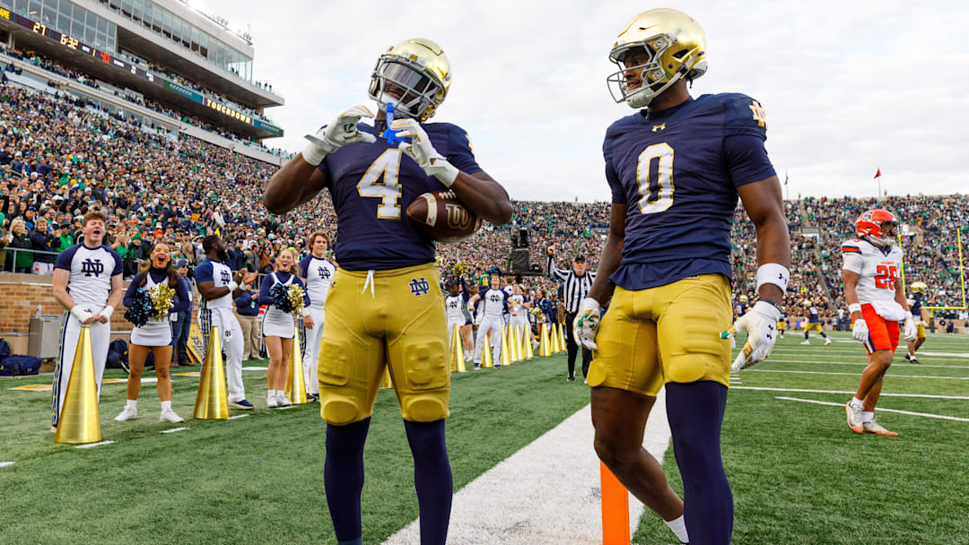 Notre Dame running back Jeremiyah Love (4) makes a heart sign after scoring a touchdown in the first half of a NCAA football game against Syracuse at Notre Dame Stadium on Saturday, Nov. 22, 2025, in South Bend.