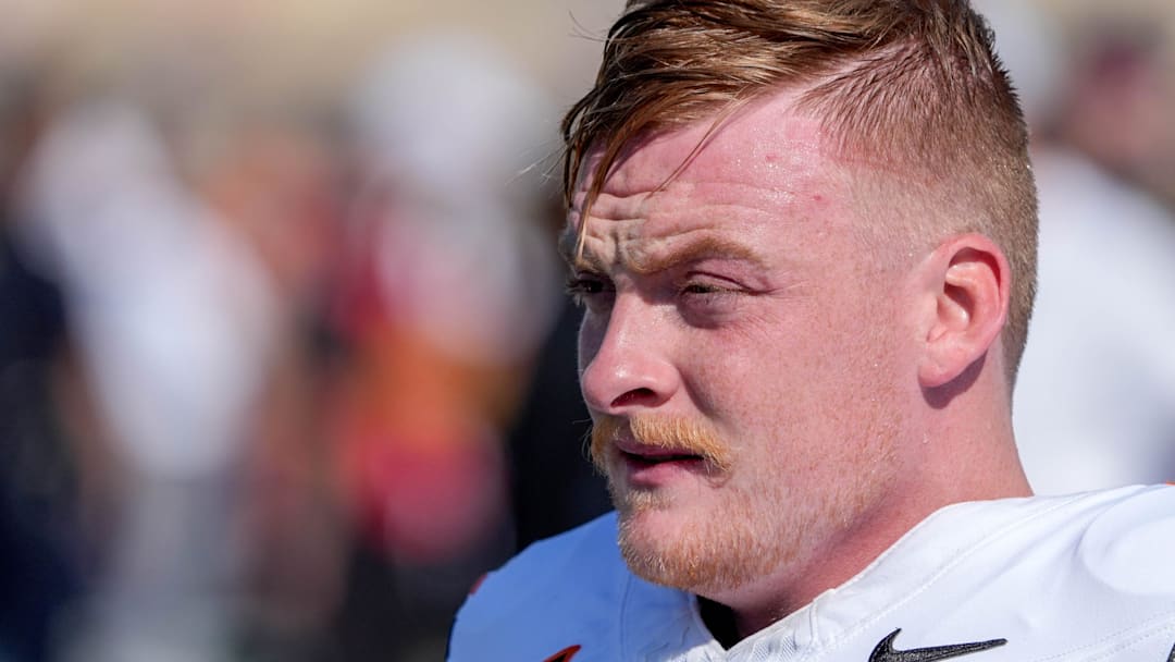 Oklahoma State quarterback Alan Bowman (7) warms up before an NCAA football game between Oklahoma State and Tulsa in Tulsa, Okla., on Saturday, Sept. 14, 2024.