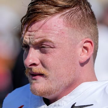 Oklahoma State quarterback Alan Bowman (7) warms up before an NCAA football game between Oklahoma State and Tulsa in Tulsa, Okla., on Saturday, Sept. 14, 2024.