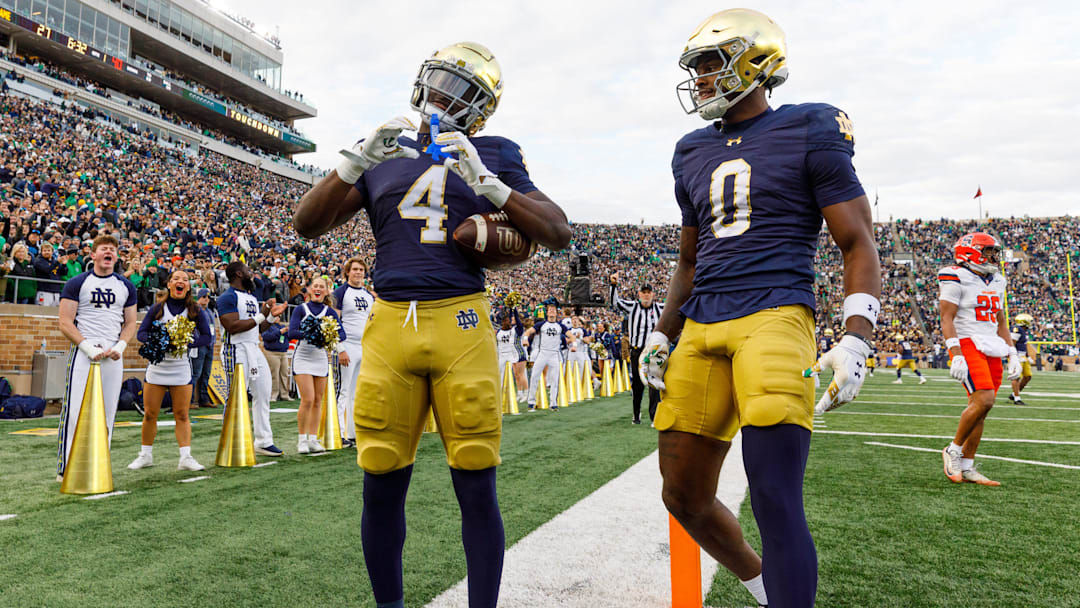 Notre Dame running back Jeremiyah Love (4) makes a heart sign after scoring a touchdown in the first half of a NCAA football game against Syracuse at Notre Dame Stadium on Saturday, Nov. 22, 2025, in South Bend.