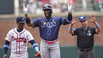 Jun 16, 2024; Cumberland, Georgia, USA; Tampa Bay Rays designated hitter Yandy Diaz (2) reacts after hitting a double against the Atlanta Braves during the first inning at Truist Park. Mandatory Credit: Dale Zanine-Imagn Images
