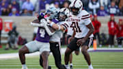 Kansas State Wildcats running back Joe Jackson is tackled by Texas Tech Red Raiders linebacker John Curry 