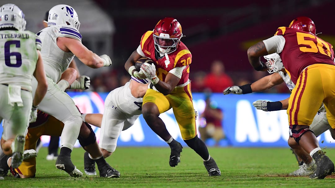 USC Trojans running back King Miller (30) runs the ball against the Northwestern Wildcats.