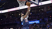 Dec 5, 2025; Oklahoma City, Oklahoma, USA; Oklahoma City Thunder guard Kenrich Williams (34) goes up for a basket against the Dallas Mavericks during the second half at Paycom Center. Mandatory Credit: Alonzo Adams-Imagn Images