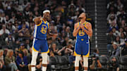 Oct 27, 2025; San Francisco, California, USA; Golden State Warriors forward Jimmy Butler III (10) talks with guard Stephen Curry (30) during a break in the action against the Memphis Grizzlies in the third quarter at the Chase Center. Mandatory Credit: Cary Edmondson-Imagn Images