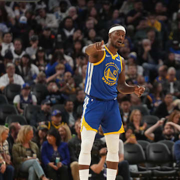 Oct 27, 2025; San Francisco, California, USA; Golden State Warriors forward Jimmy Butler III (10) talks with guard Stephen Curry (30) during a break in the action against the Memphis Grizzlies in the third quarter at the Chase Center. Mandatory Credit: Cary Edmondson-Imagn Images