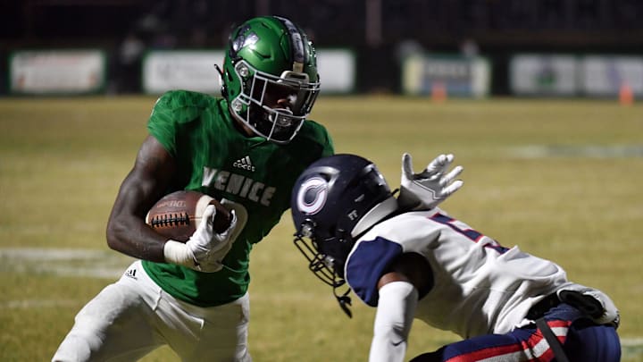 Venice High wide receive Omari Hayes takes on Miami Columbus defender Ahmere Foster (#5). Venice defeated Miami Columbus 35-7 to win the Class 8A semi-final Friday night in Venice.

Sar Fbh Venice 020