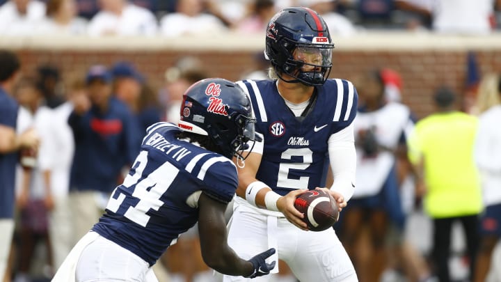 Aug 31, 2024; Oxford, Mississippi, USA; Mississippi Rebels quarterback Jaxson Dart (2) hands the ball off to Mississippi Rebels running back Ulysses Bentley IV (24) during warm ups prior to the game against the Furman Paladins at Vaught-Hemingway Stadium. Mandatory Credit: Petre Thomas-USA TODAY Sports