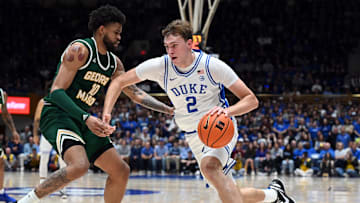 Dec 17, 2024; Durham, North Carolina, USA;Duke Blue Devils forward Cooper Flagg (2) drives to the basket as George Mason Patriots forward Zach Anderson (10) defends during the first half at Cameron Indoor Stadium. Mandatory Credit: Rob Kinnan-Imagn Images