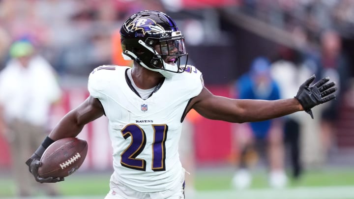 Oct 29, 2023; Glendale, Arizona, USA; Baltimore Ravens cornerback Brandon Stephens (21) celebrates an interception against the Arizona Cardinals during the first half at State Farm Stadium. Mandatory Credit: Joe Camporeale-USA TODAY Sports