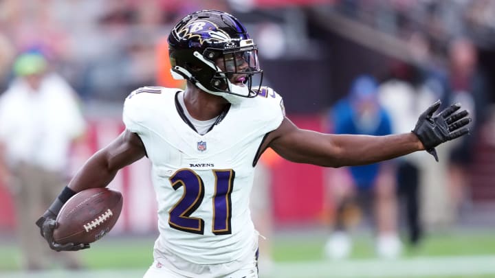 Oct 29, 2023; Glendale, Arizona, USA; Baltimore Ravens cornerback Brandon Stephens (21) celebrates an interception against the Arizona Cardinals during the first half at State Farm Stadium. Mandatory Credit: Joe Camporeale-USA TODAY Sports