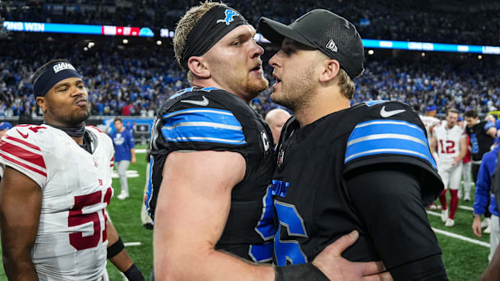 Lions defensive end Aidan Hutchinson and quarterback Jared Goff celebrate after Detroit beat the Giants in overtime on Sunday.
