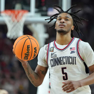 Apr 6, 2024; Glendale, AZ, USA; Connecticut Huskies guard Stephon Castle (5) reacts after a play against the Alabama Crimson Tide during the first half in the semifinals of the men's Final Four of the 2024 NCAA Tournament at State Farm Stadium. Mandatory Credit: Bob Donnan-USA TODAY Sports