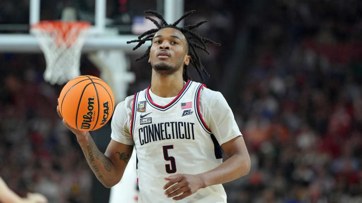 Apr 6, 2024; Glendale, AZ, USA; Connecticut Huskies guard Stephon Castle (5) reacts after a play against the Alabama Crimson Tide during the first half in the semifinals of the men's Final Four of the 2024 NCAA Tournament at State Farm Stadium. Mandatory Credit: Bob Donnan-USA TODAY Sports