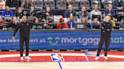Nov 17, 2025; Detroit, Michigan, USA: Detroit Pistons head coach J.B. Bickerstaff points over at Indiana Pacers head coach Rick Carlisle during the second half at Little Caesars Arena. Mandatory Credit: David Reginek-Imagn Images