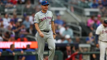 Sep 30, 2024; Atlanta, Georgia, USA; New York Mets manager Carlos Mendoza (64) makes a pitching change against the Atlanta Braves in the sixth inning at Truist Park. Mandatory Credit: Brett Davis-Imagn Images