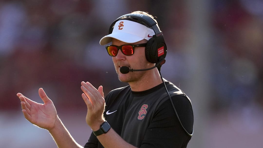 Aug 30, 2025; Los Angeles, California, USA; Southern California Trojans head coach Lincoln Riley watches from the sidelines against the Missouri State Bears in the first half at United Airlines Field at Los Angeles Memorial Coliseum. Mandatory Credit: Kirby Lee-Imagn Images