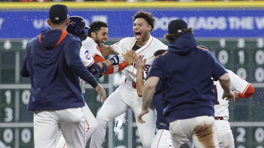Houston Astros right fielder Cam Smith (11) celebrates with teammates after hitting a walk-off RBI single.