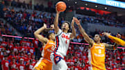 Mar 5, 2025; Oxford, Mississippi, USA; Mississippi Rebels forward Jaemyn Brakefield (4) shoots the ball against Tennessee Volunteers guard Darlinstone Dunbar (8) during the second half at The Sandy and John Black Pavilion at Ole Miss. Mandatory Credit: Wesley Hale-Imagn Images