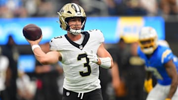 Oct 27, 2024; Inglewood, California, USA; New Orleans Saints quarterback Jake Haener (3) throws against the Los Angeles Chargers during the second half at SoFi Stadium. Mandatory Credit: Gary A. Vasquez-Imagn Images