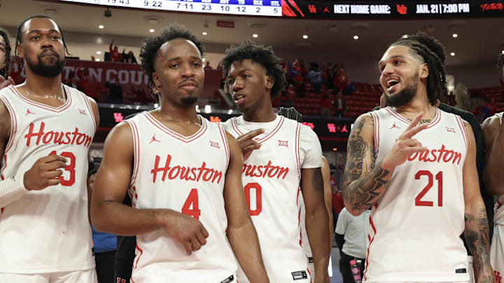 Jan 15, 2025; Houston, Texas, USA; From left to right, Houston Cougars forward J'Wan Roberts (13) guard L.J. Cryer (4) guard Kordelius Jefferson (0) guard Emanuel Sharp (21) sing the school song after defeating the West Virginia Mountaineers in the second half at Fertitta Center. Mandatory Credit: Thomas Shea-Imagn Images Jan 15, 2025; Houston, Texas, USA; From left to right, Houston Cougars forward J'Wan Roberts (13) guard L.J. Cryer (4) guard Kordelius Jefferson (0) guard Emanuel Sharp (21) sing the school song after defeating the West Virginia Mountaineers in the second half at Fertitta Center. Mandatory Credit: Thomas Shea-Imagn Images
