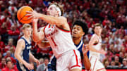 Nebraska Cornhuskers guard Sam Hoiberg shoots the ball against Creighton Bluejays guard Austin Swartz.