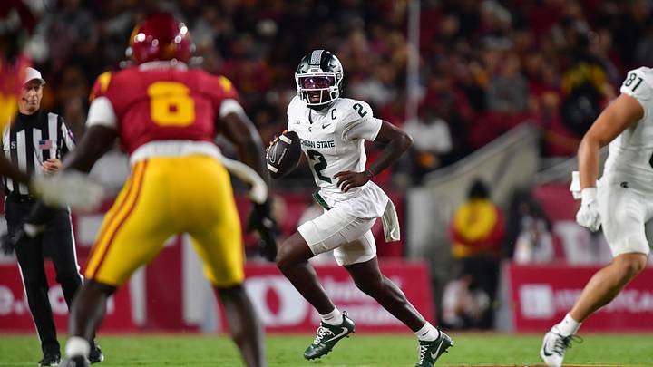 Sep 20, 2025; Los Angeles, California, USA; Michigan State Spartans quarterback Aidan Chiles (2) moves out to pass against the Southern California Trojans during the first half at the Los Angeles Memorial Coliseum. Mandatory Credit: Gary A. Vasquez-Imagn Images