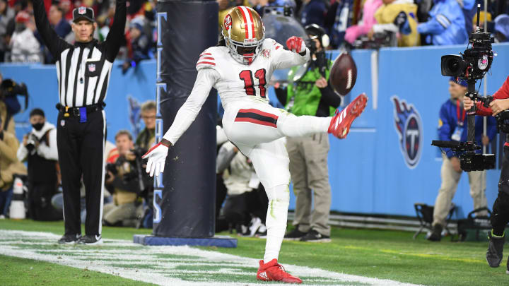 Dec 23, 2021; Nashville, Tennessee, USA; San Francisco 49ers wide receiver Brandon Aiyuk (11) kicks the ball into the stands after catching a touchdown pass during the second half against the Tennessee Titans at Nissan Stadium. Mandatory Credit: Christopher Hanewinckel-USA TODAY Sports