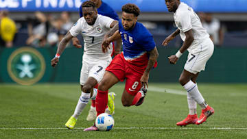 Weston McKennie dribbles away from defenders during the USMNT's Nations League semifinal game against Panama in March 2025.