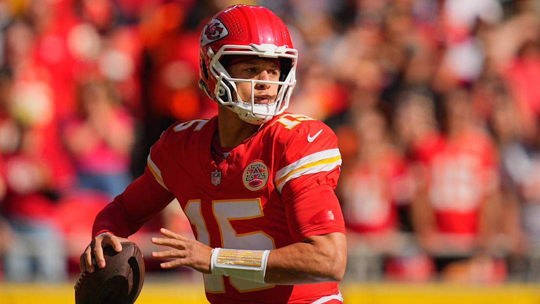 Oct 19, 2025; Kansas City, Missouri, USA; Kansas City Chiefs quarterback Patrick Mahomes (15) passes the ball against the Las Vegas Raiders during the first quarter of the game at GEHA Field at Arrowhead Stadium. Mandatory Credit: Jay Biggerstaff-Imagn Images