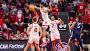 Dec 10, 2024; Piscataway, New Jersey, USA; Rutgers Scarlet Knights guard Ace Bailey (4) blocks a shot by Penn State Nittany Lions guard Freddie Dilione V (4) during the second half at Jersey Mike's Arena. Mandatory Credit: Vincent Carchietta-Imagn Images