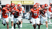 Louisville Cardinals linebacker Antonio Watts (9) celebrates his interception as Louisville Cardinals defensive lineman Denzel Lowry (45) cheers in the first half against Bowling Green at L&N Federal Credit Union Stadium in Louisville, Kentucky Sept. 20, 2025.