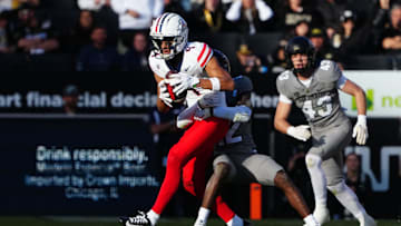 Nov 11, 2023; Boulder, Colorado, USA; Colorado Buffaloes cornerback Travis Hunter (12) tackles Arizona Wildcats wide receiver Tetairoa McMillan (4) in the second half at Folsom Field. Mandatory Credit: Ron Chenoy-Imagn Images